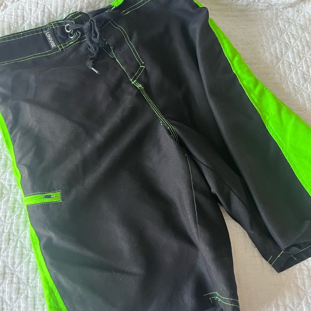 Boys Swim trunks. Size large. Black and neon green